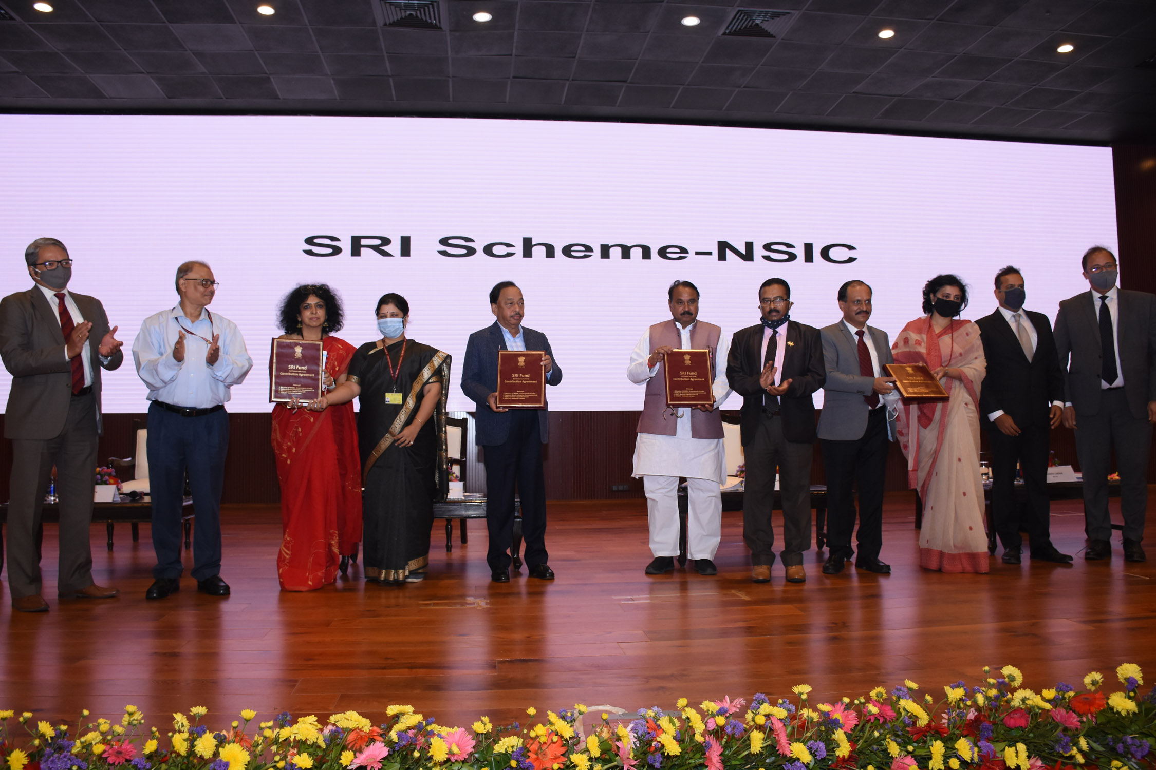 Under the benevolent guidance of Shri Narayan Rane, Honble Minister of MSME, Shri Bhanu Pratap Singh Verma, Honble MOS (MSME) and in the gracious presence of Shri B.B.Swain, Secretary, MSME and Ms.Alka Arora, CMD NSIC and Chairperson NVCFL, the Contribution Agreement of Self Reliant India (SRI) Fund, a Category II Alternative Investment Fund for providing growth capital to MSMEs was signed on 12th Oct 2021 between Ministry of MSME, Government of India, the Anchor Investor, Sponsor The National Small Industries Corporation Ltd.,  NSIC Venture Capital Fund Ltd., the AIF Company and SBICap Ventures Limited, the Investment Manager. Dr. Ishita  G. Ganguly, ADC signed on behalf of the Ministry, Shri P. Udayakumar, Director (P&M) signed on behalf of NSIC, Shri Gaurang Dixit, Director and CEO, on behalf of NVFCL and Shri K. Suresh, MD & CEO on behalf of SBICap Venture Ltd.