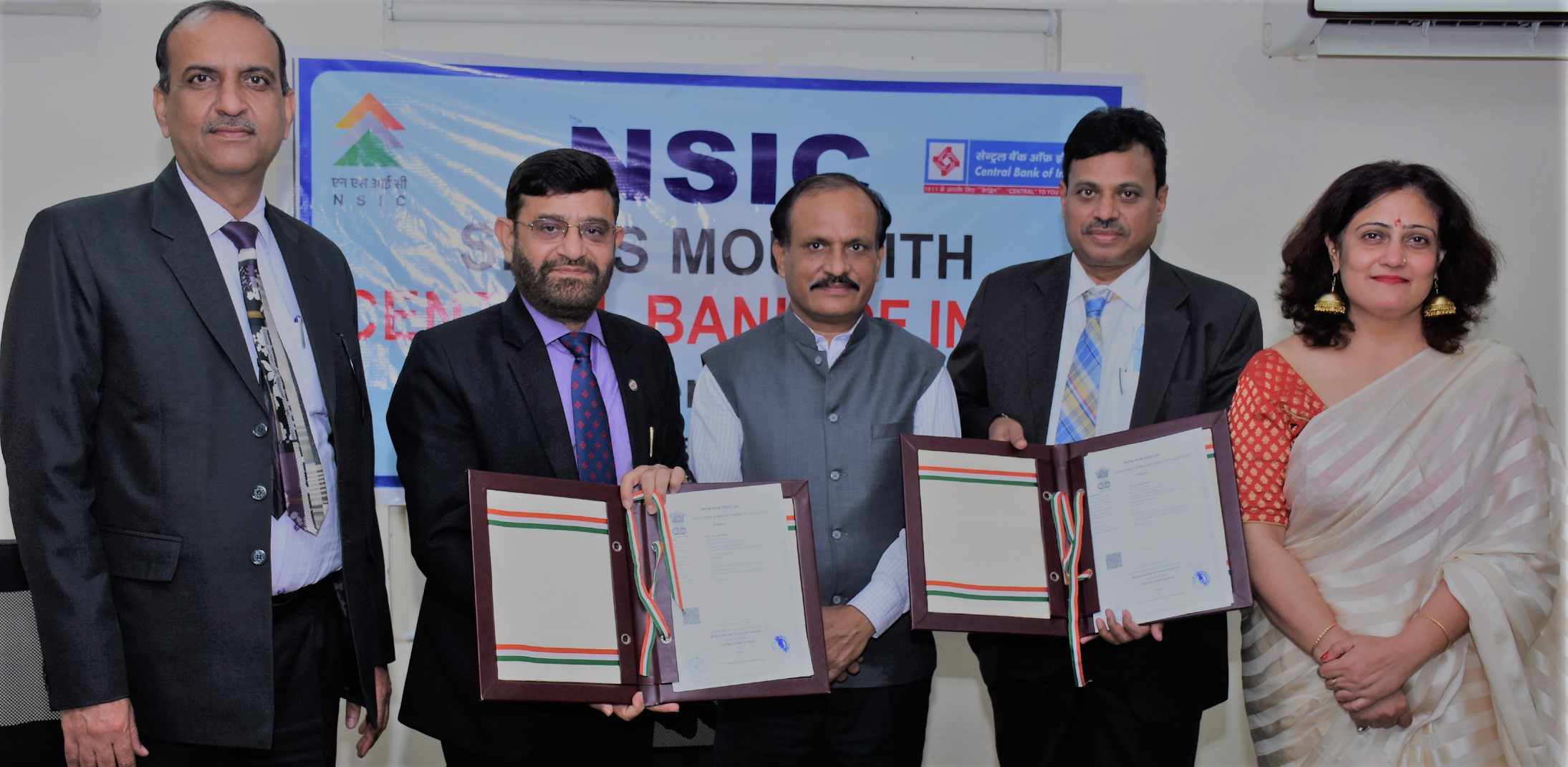 Shri Gaurang Dixit, Director (Finance), NSIC presided the NSIC signing of MoU with Central Bank of India on   1st November 2021 under its Bank credit facilitation scheme. The major thrust of the MoU is to promote MSMEs by providing them with credit support under this tie up arrangement. Also present on the occasion were Sh. P.Ravi Kumar, Chief General Manager (BD), NSIC, Sh. V.K Mahendru, Field General Manager, Central Bank of India, Ms Himani Shali, Chief Manager (Bank Tie up), NSIC and Sh. Ashwani Dhingra, Sr. Regional Manager, Central Bank of India.