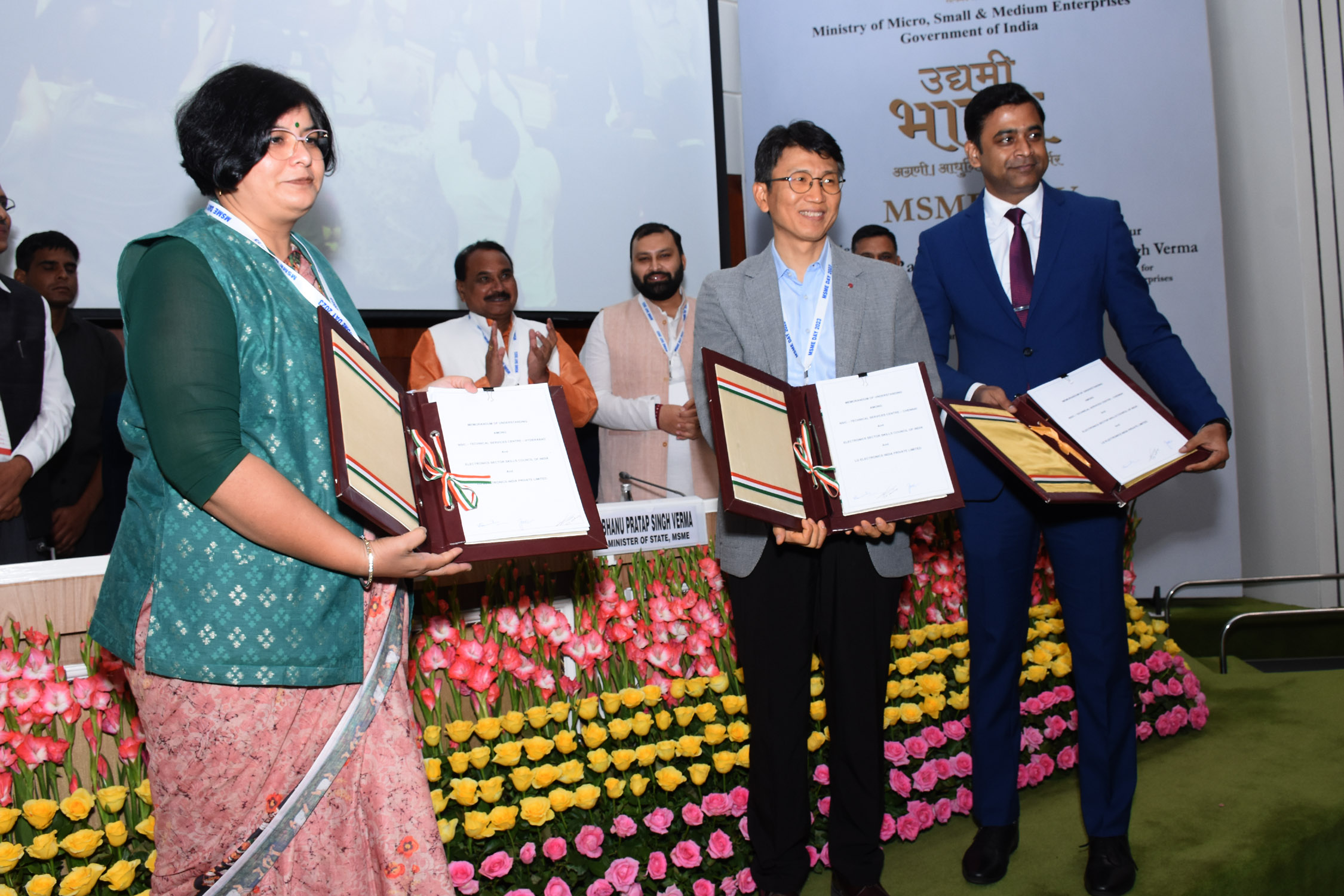 On the occasion of MSME Day, NSIC signed MoU with LG Electronics India Pvt Ltd. (LG)and Electronics Sector Skills Council of India(ESSCI) on 27th June, 2023 in the presence of Shri Narayan Rane, Honourable Cabinet Minister of MSME, Shri Bhanu Pratap Singh Verma, Honorable Minister of State of MSME, Shri S. C. L. Das, Secretary ( MSME) .The MoU was signed by Mr. Kartikeya Sinha, Director (Planning & Marketing), NSIC, Dr. Abhilasha Gaur, Chief Operating Officer, ESSCI and Mr. Tae Jin Chang, Vice President, LG Electronics India Pvt. Ltd. In this endeavour, the LG Electronics and Electronics Sector Skills Council of India (ESSCI) will set up a Centre of Excellence at NSIC - Technical Services Centre at Chennai and Hyderabad, aimed at training to under privileged youth in the fields of consumer electronics and appliances. This will open new avenues in field of electronics for the youth and generate skilled manpower for employment in this sector. In the first year 1200 youths would be benefited by getting trained in electronics goods servicing and repairing.