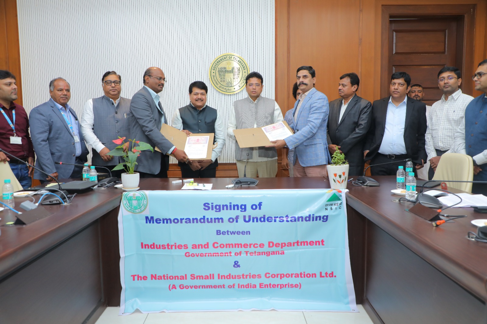 In order to strengthen the MSME ecosystem in Telangana, TEJAS (Telangana entrepreneur Journey for Accelerating Success) was launched on August 28, 2024 by Signing an MOU between Department of Industries and Commerce, Government of Telangana and The National Small Industries Corporation Limited (NSIC). NSIC is an ISO 9001:2015 certified Mini-Ratna Government of India Enterprise, under Ministry of MSME. The aim is to promote, aid and foster the growth of micro, small and medium enterprises in Telangana. 
NSIC facilitates MSMEs with a set of specially tailored schemes to enhance their competitiveness. NSIC provides integrated support services under Marketing, Technology, Finance and other Support services. NSIC supports MSMEs with Raw Material Assistance, Bill Discounting, Single Point Registration, Digital Facilitation, Credit facilitation and also facilitate materials testing and provides skill development trainings in its training centres located in the country as one in Hyderabad, in order to cater to the needs of skilled manpower of MSME Sector and to build entrepreneurship.
Under the MoU, District Industries Centers located in 33 districts of Telangana State shall promote the schemes of NSIC among the MSMEs in their districts and also collaborate with NSIC for skill development activities. 
The MoU was signed by Dr. G. Malsur, Director, Department of Industries and commerce, Government of Telangana and Sri K. Srinivas, in the presence of Sri D. Sridhar Babu, Hon’ble Minister for IT & Industries, Government of Telangana and Dr. Subhransu Sekhar Acharya, Chairman and Managing Director, NSIC. Also present on the occasion are Sri Gaurav Gulati, Director (Fin.), Sh. Ravi kumar CGM, Sh. N.K. Subramani GM (NTSC Hyderabad)  from NSIC.
