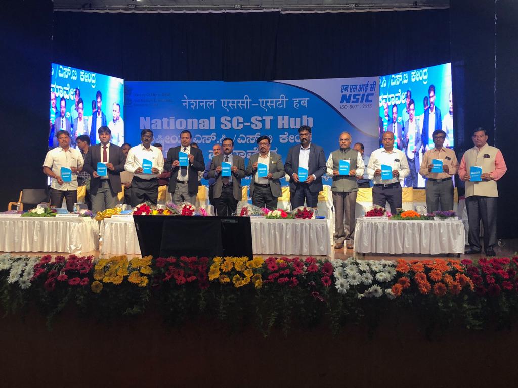 The National SC-ST Conclave was held on 15th December 2018 at, Hubballi, Karnataka. The event was attended by over 352 SC-ST participants including women participants. The event also had stalls from various banking institutions i.e. Bank of Baroda, SBI, Ujjivan Small Finance and CPSEs such as HLL Life Care Limited. The CPSEs had brought samples of their products and showcased these to the participants. During the event, several entrepreneurs also showcased their products. Further to this, there was designated stall of MSME-DI, KVIC, and NSSH Bangalore.Sh. P. Udayakumar, Director (P&M),NSIC, New Delhi was the Chief Guest of conclave. The other dignitaries graced the occasion were Shri Nilogal L.B, Executive Director, KFSC, Bangalore, Shri Ravi Prakash, CGM (Commercial), Goa Shipyard, Goa, Shri Sunil Kharad, GM(Vendor Development Cell), BEML, Bangalore, Shri K. Hariprasad, Asst. General manager (Materials), HMT Machine Tool Ltd, Bangalore, Shri P.N Lokesh, DGM(MM), ITI Ltd, Bangalore, officials from State Industry associations, Senior officers from CPSEs and Banking sector were also present during the event. The welcome address was given by Shri P Ravi Kumar, CGM, NSIC – Bangalore. He gave a brief introduction on the National SC ST Hub and thanked all the dignitaries and participants for providing their support for the conclave. Shri P Udayakumer, DPM, NSIC thanked everyone on the dais as well as the participants. He told that the MSME sector is the backbone of the Indian economy and SC-ST MSEs are an integral part of this. He shared that earlier in the morning, he interacted with local SC-ST MSEs of Hubballi and found potential to supply the CPSEs. He talked about the various Scheme under the National SC-ST Hub and Ministry of MSME. He pointed out that the State Government of Karnataka is providing several subsidy schemes to MSEs. He requested to potential SC-ST MSEs to participate in SVDPs to be organized by the NSIC and NSSHO.  He talked about initiatives have been taken by the Ministry for capacity building of SC-ST MSEs. In last, he requested that at least 100 SC- ST entrepreneurs from Hubballi should register from NSIC after completion of conclave.