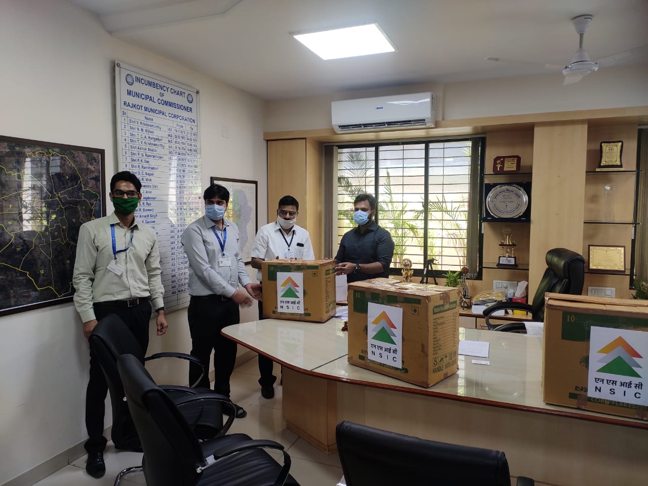 Shri Udit Agrawal, IAS, Municipal Commissioner, Rajkot (RMC), was handed over the 3000 nos. Face Masks for distribution by NSIC to join the fight against COVID-19. This NSIC initiative under CSR was taken by  Shri U Venkatachalapathi (GM & NTSC, Centre Head), Rajkot on 24/04/2020 with his team Shri Kamalkant Sahu (Dy. Manager) and Shri Raviprakash Vala (Asst. Manager), NTSC (Rajkot).
