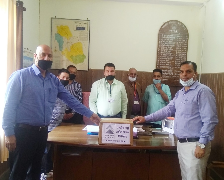 In continuation of Nation's fight with COVID19, officers of Mandi (H.P.) office of The National Small Industries Corporation Ltd. (NSIC) Sh. Lokesh Bhatia (Dy. Manager) & staff provided Face Masks and Hand Gloves to MUNICIPAL COUNCIL MANDI (H.P.)  Sh. Virender Bhatt (Vice President) in presence of Sh. B.R.Negi (Exec. Officer), Sh. Vishal Thakur (Member), Sh. Pushpraj Katyayan(Member) and Sh. Bansi Lal (Member) for distribution to frontline workers of their department.