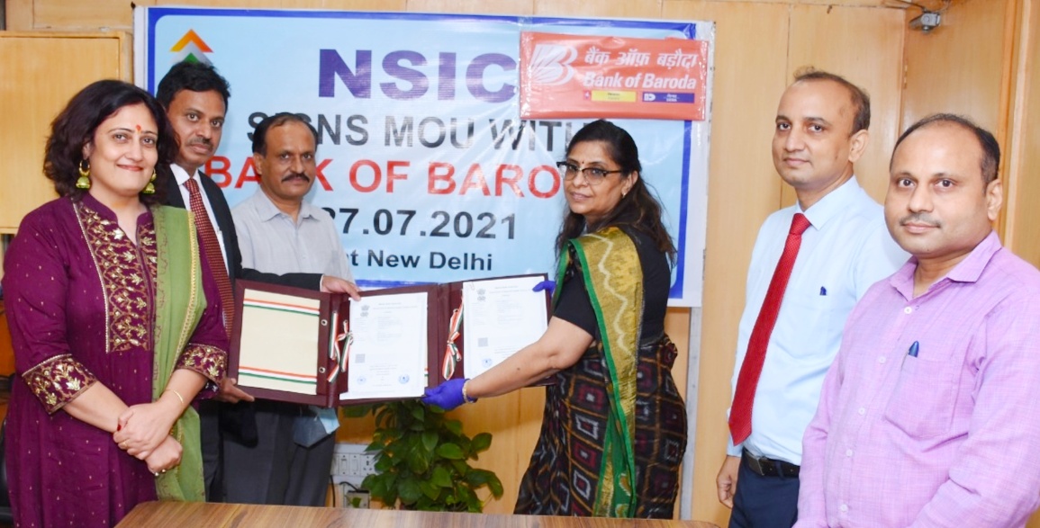 NSIC enters into MoU with Bank of Baroda on 27.07.2021 at New Delhi for building a long-term and strategic partnership with a commitment to support MSMEs with their credit requirements. This MoU was signed by Sh. P. R Kumar, CGM, NSIC and Smt. Sammita Sachdev, General Manager, Bank of Baroda in the presence of Sh. Gaurang Dixit, Director (Finance), NSIC. Also present on the occasion was Ms Himani Shali, CM (Bank Tie Up), Sh Ragunath Chief Manager, NSIC and Sh. Vishal, AGM, Bank of Baroda.